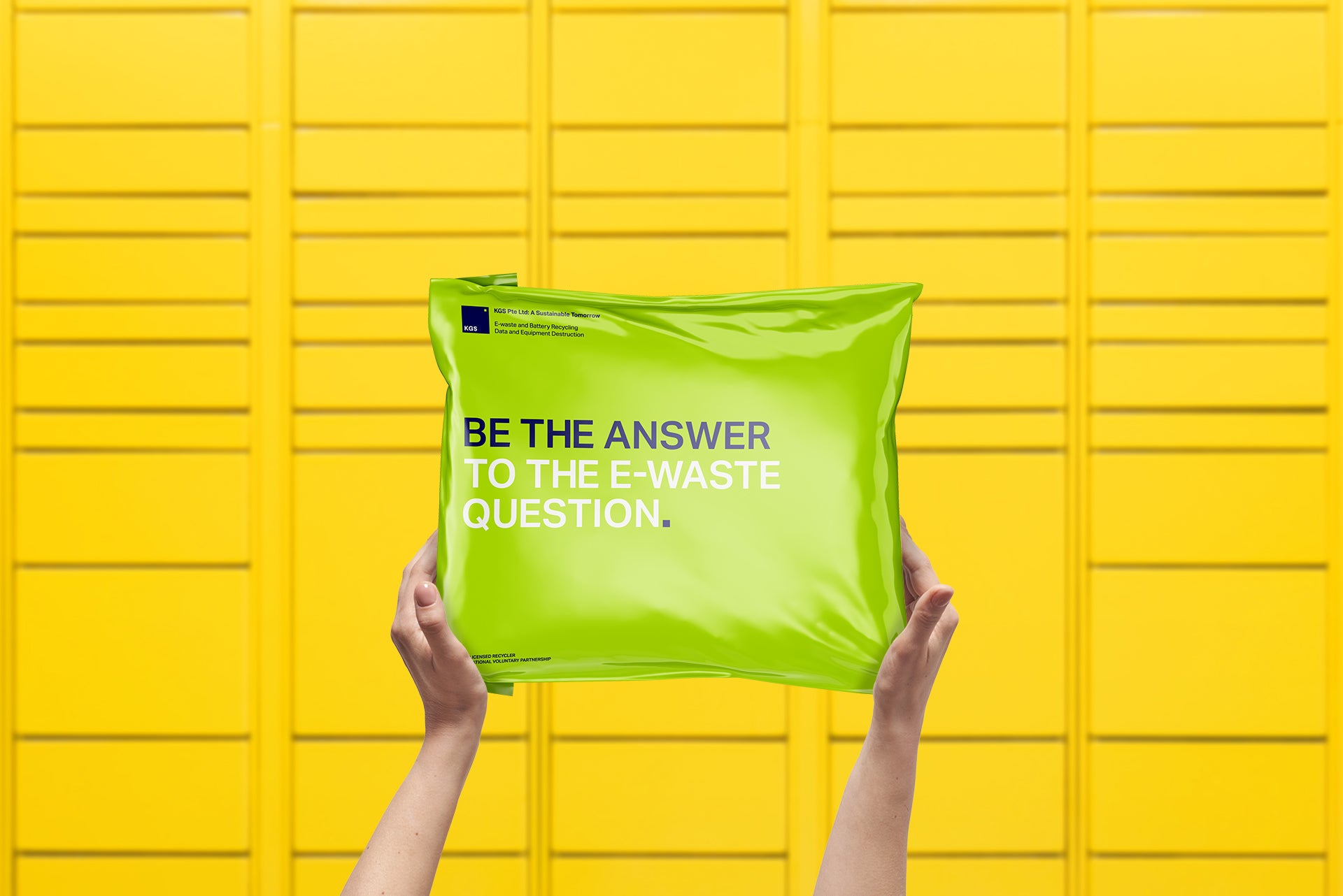 Hands holding TakeBag polymailer for e-waste recycling in Singapore