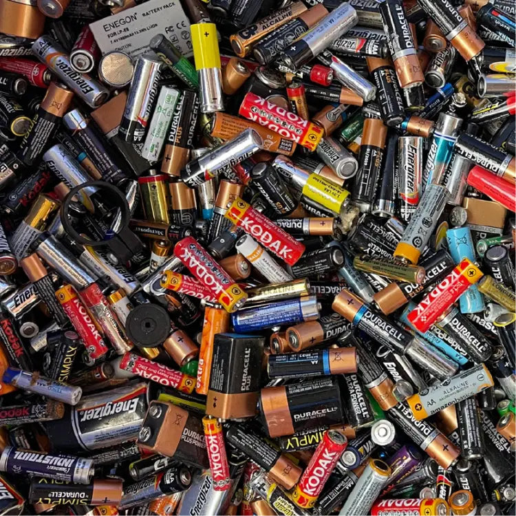 Assorted batteries from various brands in a pile for recycline